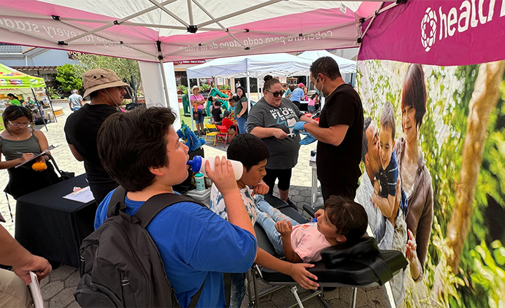 hildren having their teeth cleaned and varnishes applied at a Health Net outreach event.