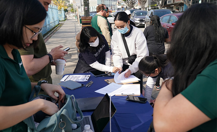 Community Health Workers providing services at a community event.