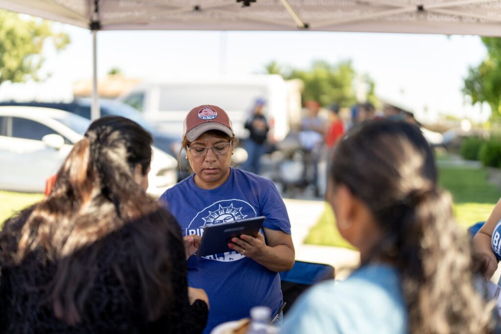 Binational employee at a community event.